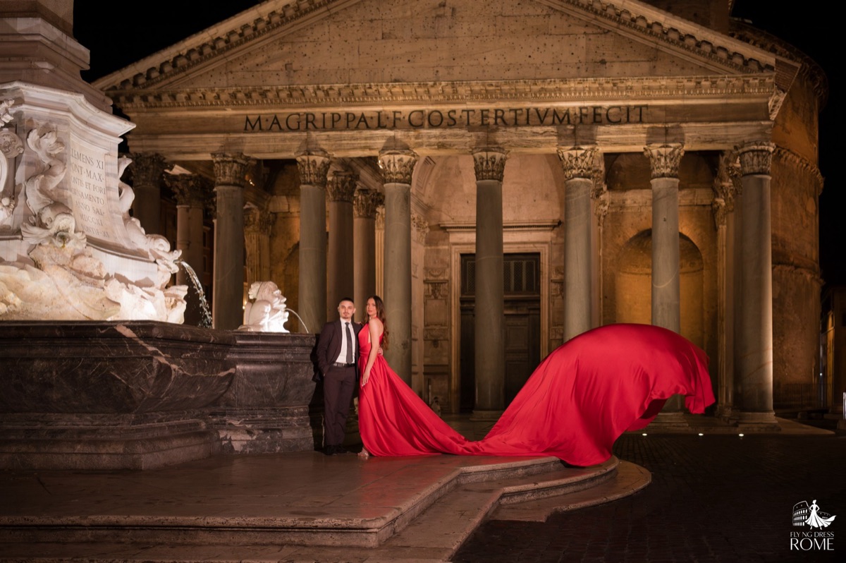 Couple flying dress pose The Classic: couple standing in front of the Pantheon lit at night with the red train flying, Rome